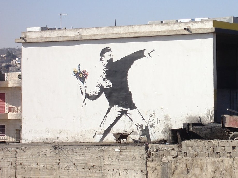 love-is-in-the-air-flower-thrower-banksy